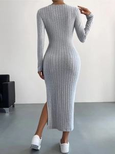 Detail view of the ribbed fabric and side slit on this grey long sleeve maxi knit dress