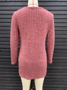 Detail of pink ribbed knit texture and slim fit design on women's long sleeve cardigan