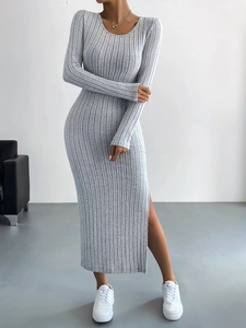 Close-up of gray long sleeve knit dress featuring vertical ribbing and side slit detail