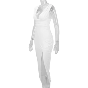 Detailed view of white slim fit maxi dress featuring deep V-neck and high front slit detail