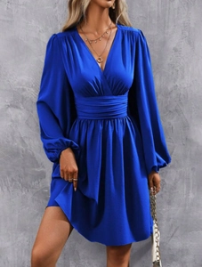Detail of elegant bright blue V-neck dress with lantern sleeves and a cinched waistline