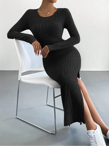 Detailed view of the dark grey ribbed knit dress featuring a stylish high side slit hem