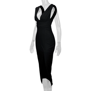Detail of elegant black deep V-neck sleeveless dress with ruched waist and high side slit