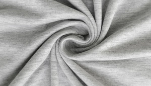 Macro shot of grey marl knit fabric texture with soft swirl drapes and detailed fibers