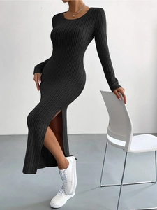 Close-up of the elegant side slit and ribbed fabric texture on this black knit dress