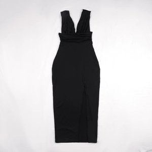Detail of elegant black deep V-neck sleeveless dress with ruched waist and high side slit