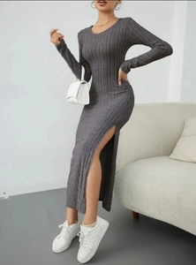 Detail of grey ribbed knit long sleeve dress showing side slit and high-quality texture