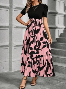 Detail of elegant black bodice and pink floral leaf print skirt with waist tie belt