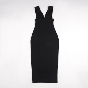 Flat lay macro view of the deep V-neckline and slim fit tailoring on a black sleeveless dress