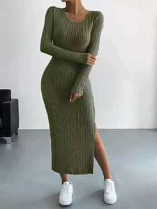 Detail of the side slit and ribbed knit texture on the green long sleeve midi dress