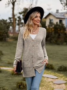Detail of taupe ribbed knit cardigan with V-neckline, front buttons and large dual pockets