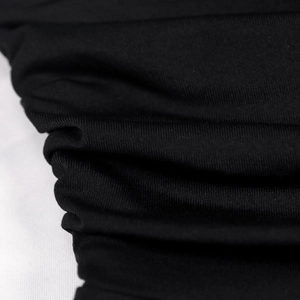 Detailed close-up of black ruched fabric texture with elastic knit pleated design