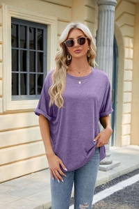 Detail of lavender oversized t-shirt with rolled sleeves and dropped shoulders on a model