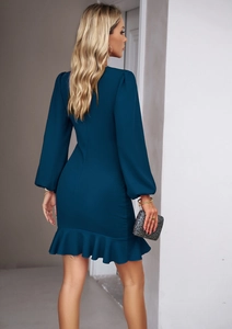 Rear view of peacock blue mini dress featuring puff lantern sleeves and ruffled hem details