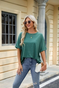 Close-up of rolled sleeves and crew neck detail on this sage green loose cotton t-shirt