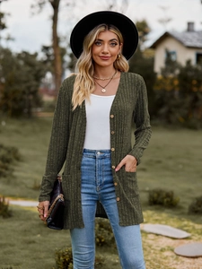 Close-up of army green ribbed knit cardigan featuring textured fabric and wooden buttons