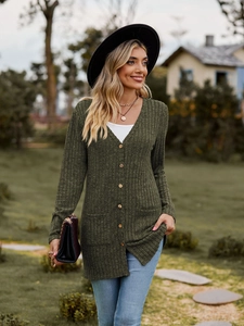 Outdoor street style view of long army green ribbed knit cardigan with side pockets