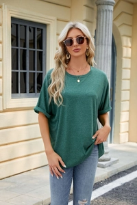 Detailed macro shot of dark green short sleeves with rolled cuffs on loose t-shirt