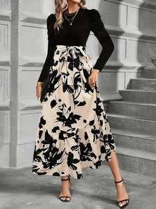 Completo da donna due pezzi con top nero a maniche lunghe e gonna lunga floreale
