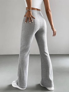 Women's light grey ribbed knit flare pants with a high waist and slimming fit design