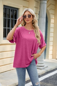 Detail of rose red crew neck T-shirt with rolled cuffs and dropped shoulder sleeves