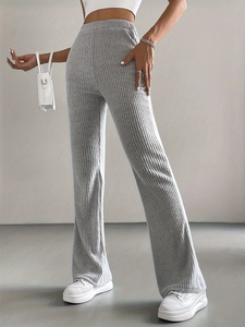 Close-up detail showing the grey ribbed knit texture and waist of the flare pants