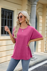 Detail of loose fit magenta crewneck t-shirt with drop shoulder sleeves and marl texture