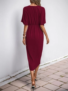 Back view of a wine red short sleeve midi dress featuring an elastic high waist and pleats