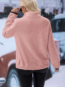 Close-up of pink Sherpa jacket texture with elastic black cuffs on long sleeves