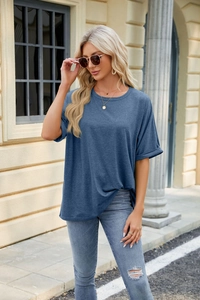 Close-up of short sleeve navy blue crew neck t-shirt with rolled cuffs and soft texture