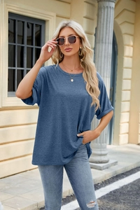 Detail of rolled cuff and premium knit fabric on blue short sleeve round neck t-shirt