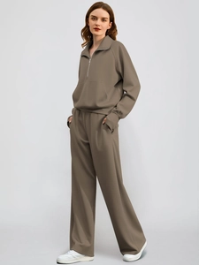 Detail view of coffee-colored sweatshirt set with stand collar and loose wide-leg trousers