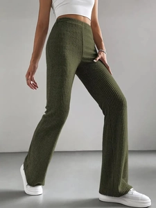 Detail shot of olive green ribbed knit flared trousers with high waist and vertical texture