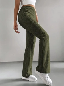 Detail view of olive green ribbed knit flare pants with high-waisted slimming fit for women