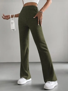 Detail shot of olive green ribbed knit trousers with high waist and flared leg style