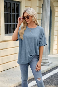 Detail of soft knit texture and rolled cuffs on a fog blue crewneck short sleeve t-shirt