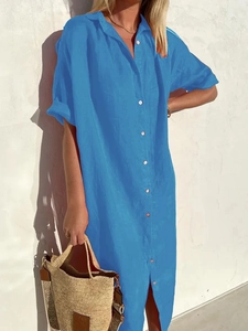 Detail of short sleeve cotton linen maxi shirt dress with buttons and natural texture