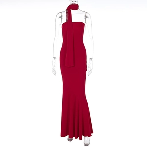 Detail of elegant red strapless evening dress with matching scarf and fishtail hemline