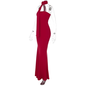Detail of red strapless maxi dress featuring a matching long scarf and slim fit silhouette