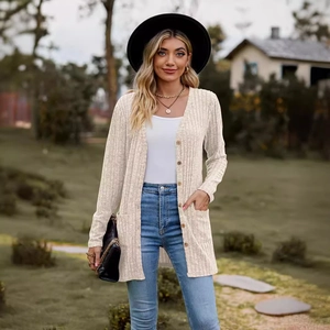 Beige ribbed knit long cardigan with wooden buttons and pockets in a chic autumn style