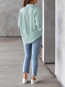 Rear view of women's casual loose long sleeve shirt with green and white vertical stripes