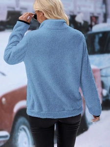 Detailed back view of light blue quarter-zip fleece jacket with soft plush texture
