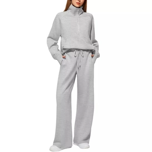 Grey two-piece set featuring half-zip sweatshirt and wide-leg sweatpants for women