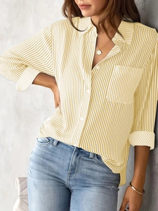Detail shot of yellow and white vertical striped long sleeve shirt with front pocket