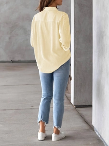 Rear view of yellow vertical striped casual long sleeve shirt for women with curved hemline