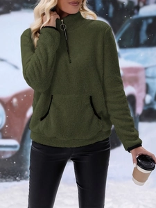 Detail of army green plush fleece sweatshirt with half-zip and ring zipper puller
