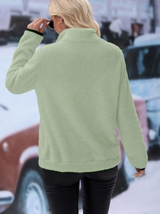 Rear view of a sage green plush fleece jacket showing texture and back silhouette