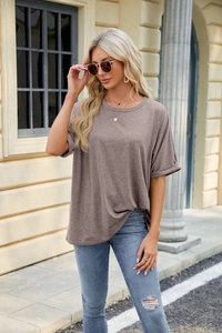 Detail of rolled cuffs and loose fit on a mauve crew neck short sleeve T-shirt for women