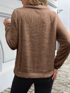 Rear view of brown teddy fleece sweatshirt featuring half-zip and high-quality plush fabric