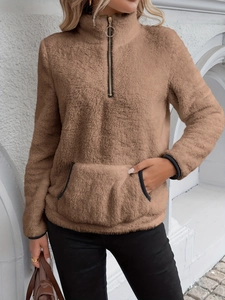 Detail of coffee brown fleece pullover featuring a metal O-ring zipper and kangaroo pocket